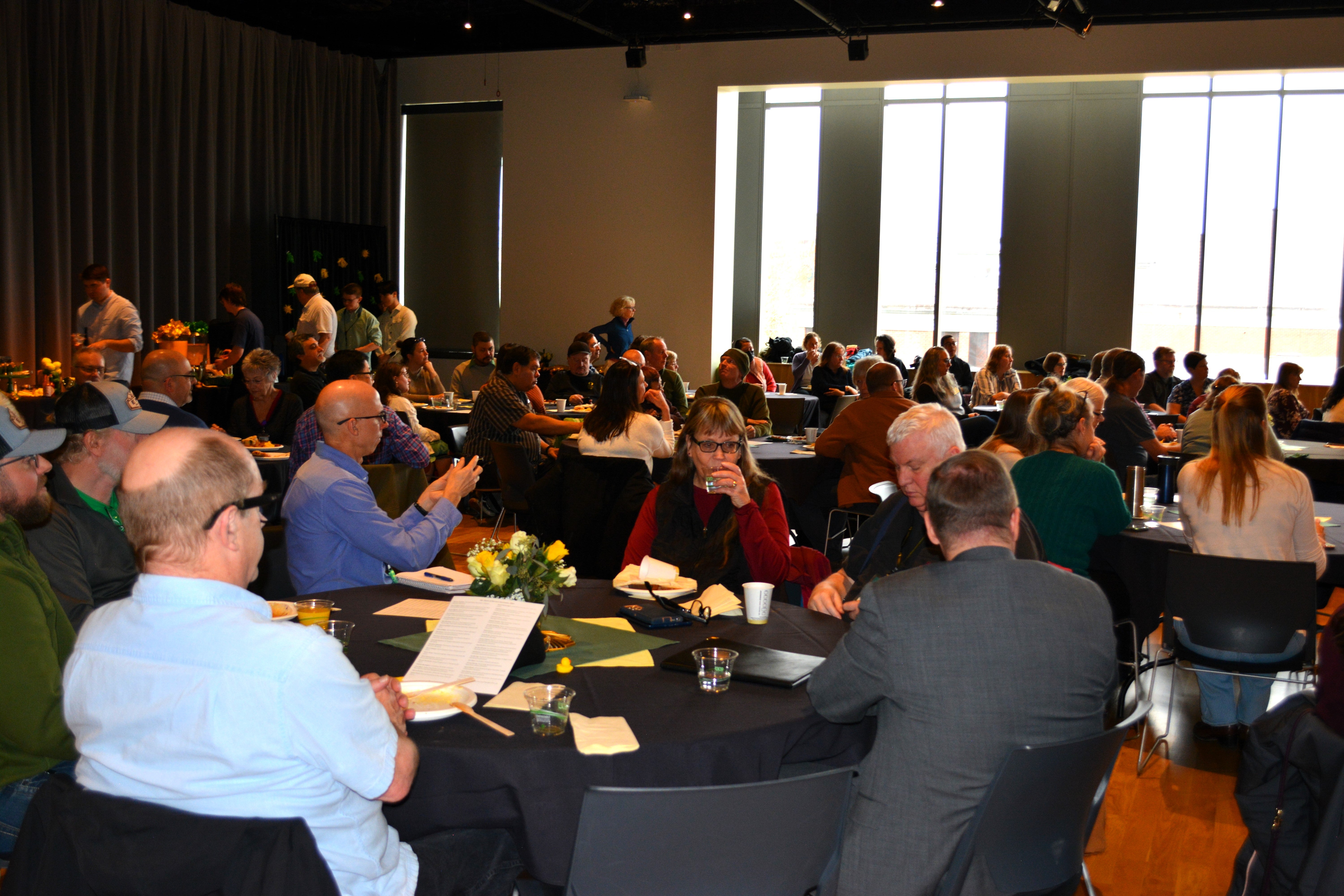 honorees seated at tables and enjoying brunch