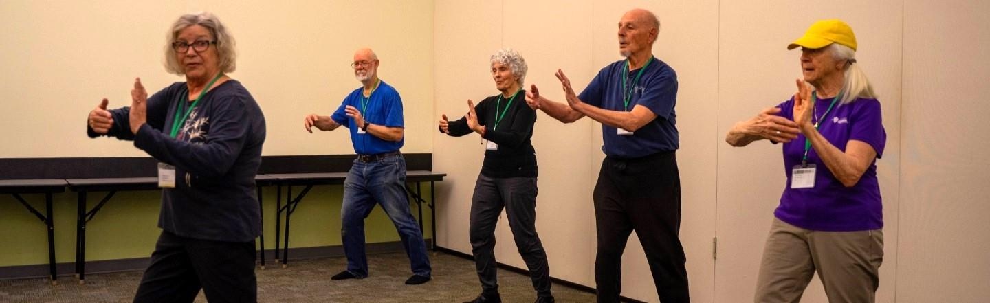 retirees doing t'ai chi at OLLI-UO