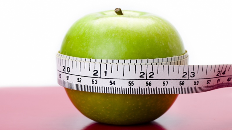 a pictre of an apple with a measuring tape around it